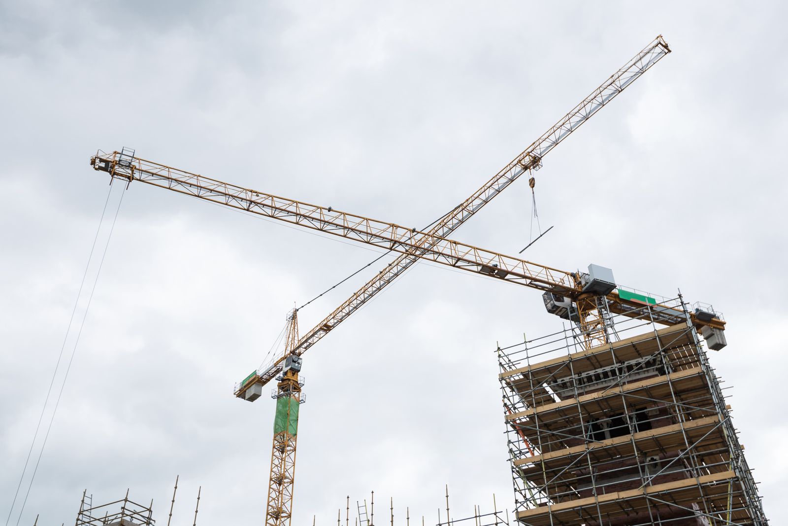 Tower cranes above a new build construction site
