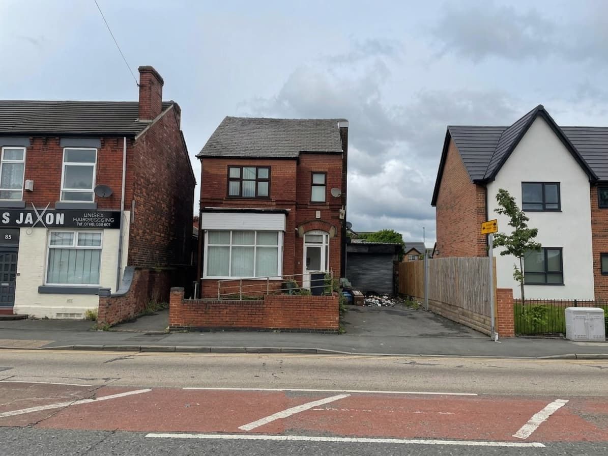 Detached brick house before refurbishment