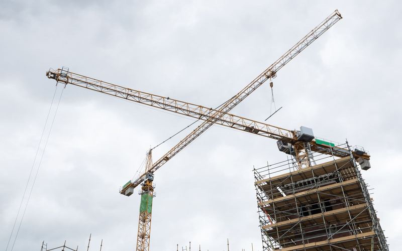 Tower cranes above a new build construction site